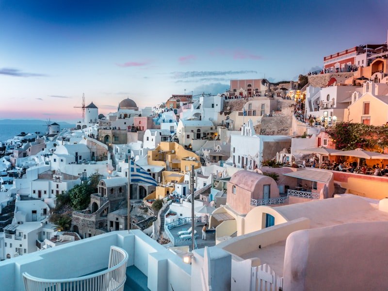 Greece - Santorini white buildings and blue domes overlooking the Aegean Sea